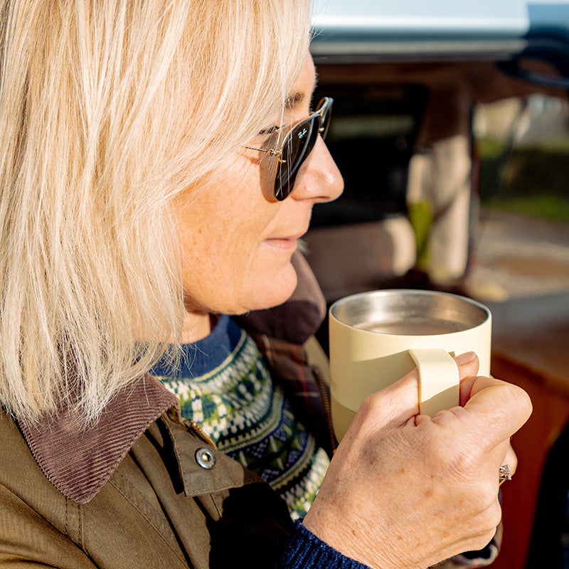 12oz-rise-mug-l9 12oz_rise_coffee_mug_wax_yellow_woman_drink_closeup_square.jpg
