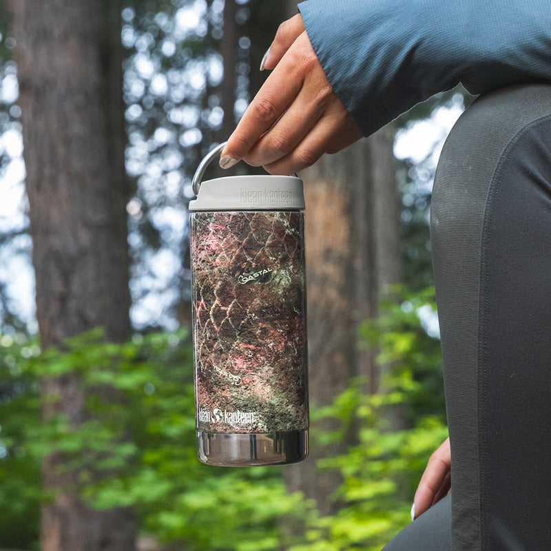 12oz-tkwide-with-twist-cap-mossy-oak-l0 12oz_tumbler_mossyoak_rainbowtrout_hand_closeup_square.jpg