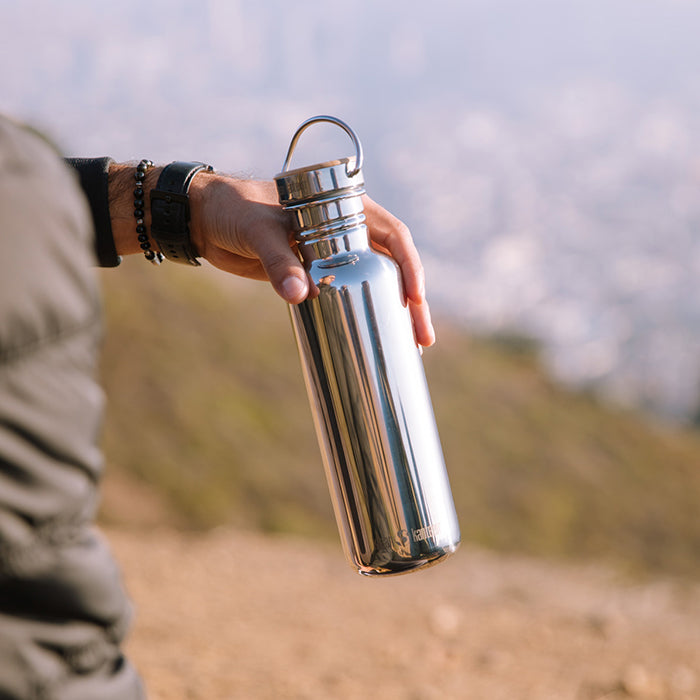 27oz-reflect-with-bamboo-cap-e7 K27SSLRF-MS-BAMBOO_reflect_bottle_hand_lifestyle.jpg