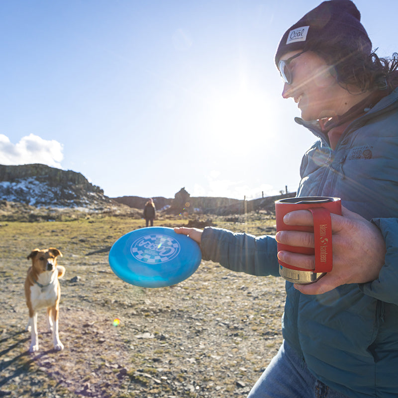 12oz-camp-mug-w0 insulated_camp_mug_12oz_woman_dog_frisbee_square.jpg